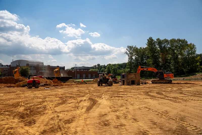 Largent excavators, a loader and haul trucks working an open site